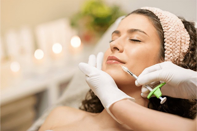 Botox treatment being administered for facial rejuvenation at wellness clinic, skin care, aesthetic injection, anti-aging therapy, cosmetic treatment for youthful skin, Massachusetts wellness center.