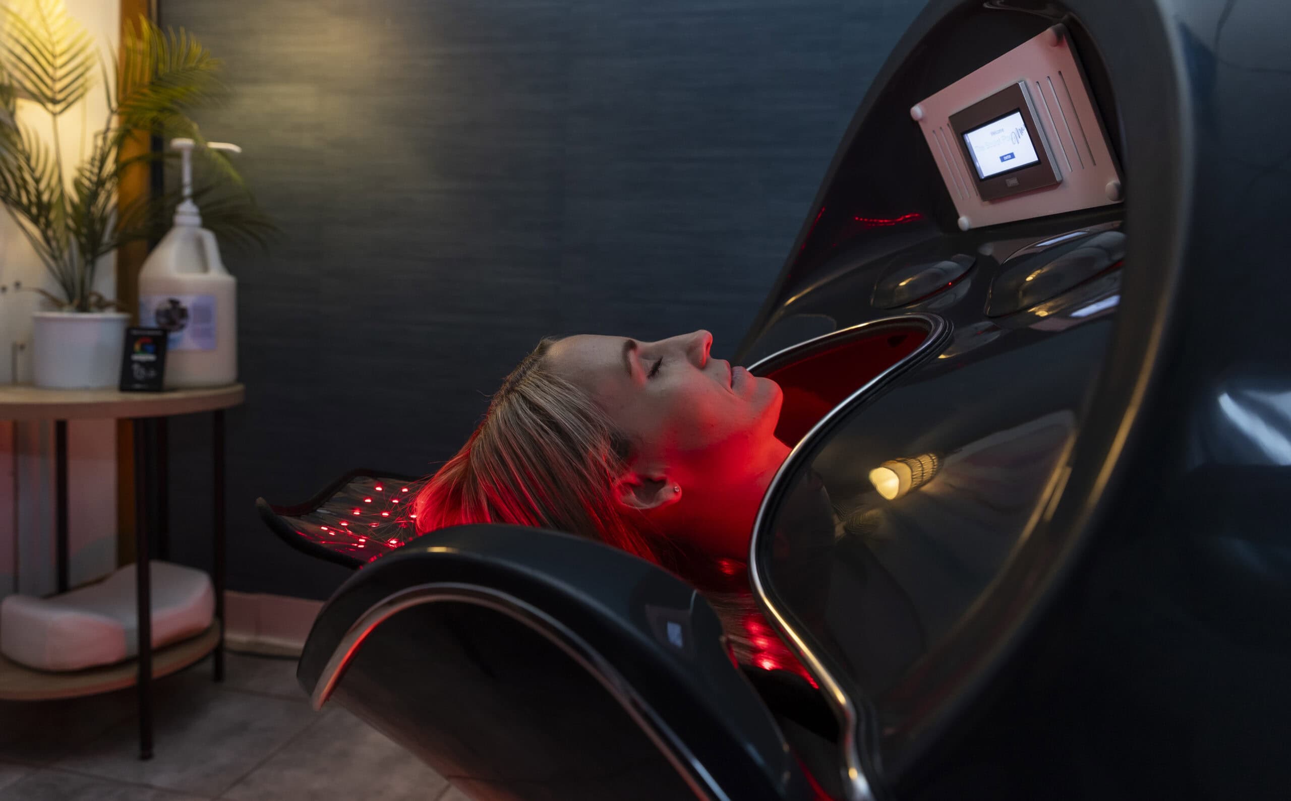 Relaxing woman undergoing NAD+ therapy at wellness clinic in Holyoke, MA for wellness, anti-aging, and detox.