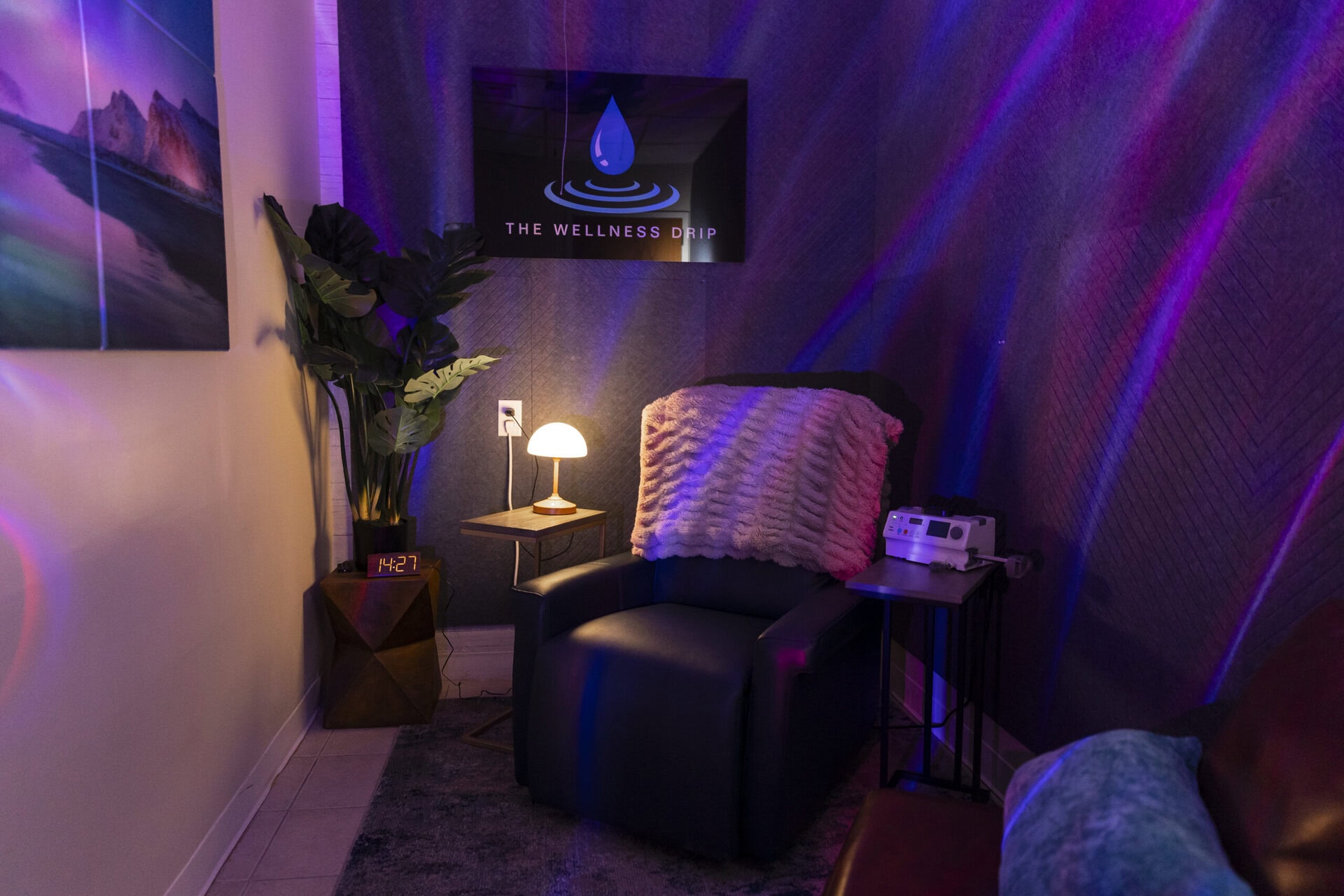 Relaxing clinic room with comfortable chair, soft lighting, and wellness services like IV therapy, NAD+, and ketamine treatments at The Wellness Drip in Holyoke, MA.