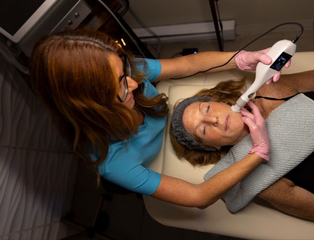 Patient experiencing and learning what is jet plasma treatment at The Wellness Drip Inc